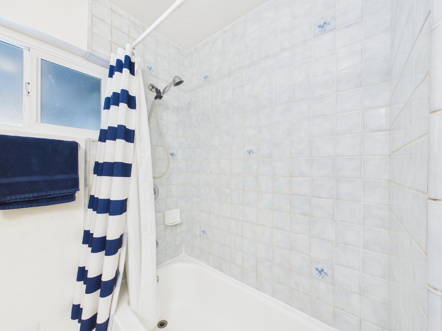 37777 China Creek Road Oakhurst, CA 93644 - Photo 26 of 64 a bathroom with a bathtub and shower
