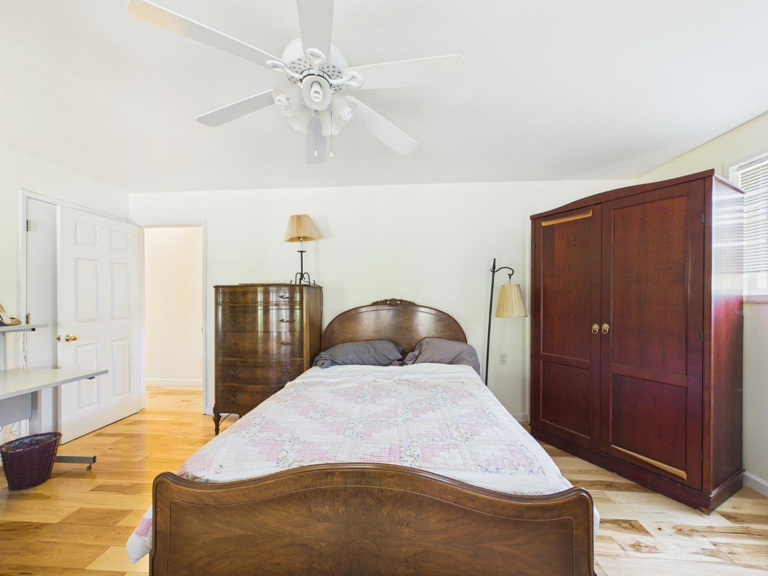 37777 China Creek Road Oakhurst, CA 93644 - Photo 28 of 64 a bedroom with a bed and wooden floor