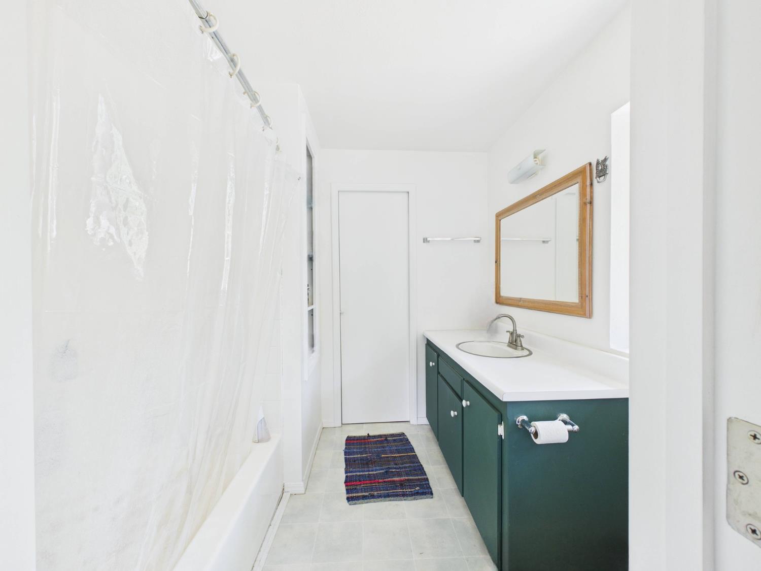 37777 China Creek Road Oakhurst, CA 93644 - Photo 32 of 64 a bathroom with a double vanity sink and mirror