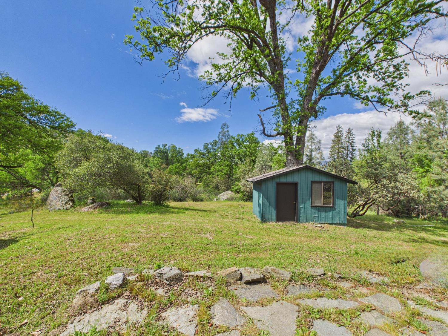 37777 China Creek Road Oakhurst, CA 93644 - Photo 39 of 64 a view of a house with a yard