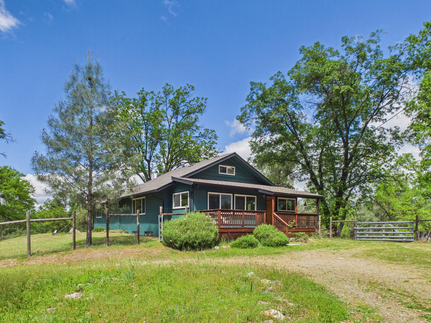 37777 China Creek Road Oakhurst, CA 93644 - Photo 4 of 64 a view of a house with a yard