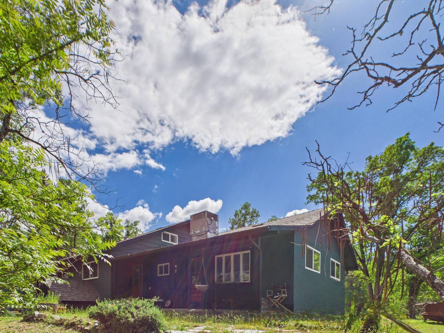 37777 China Creek Road Oakhurst, CA 93644 - Photo 41 of 64 a view of a house with a yard