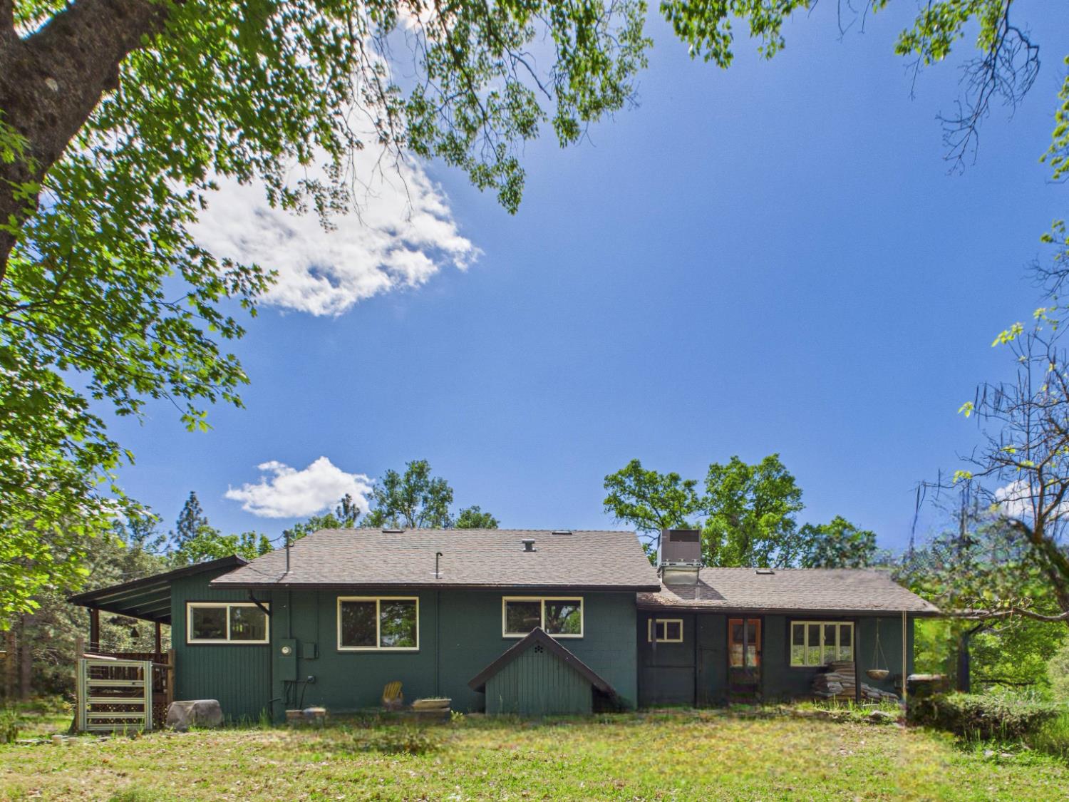 37777 China Creek Road Oakhurst, CA 93644 - Photo 43 of 64 a front view of a house with a yard