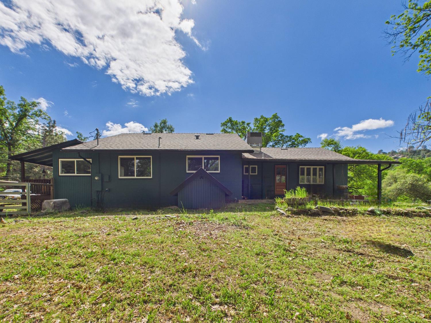 37777 China Creek Road Oakhurst, CA 93644 - Photo 44 of 64 a house is sitting in middle of the green field