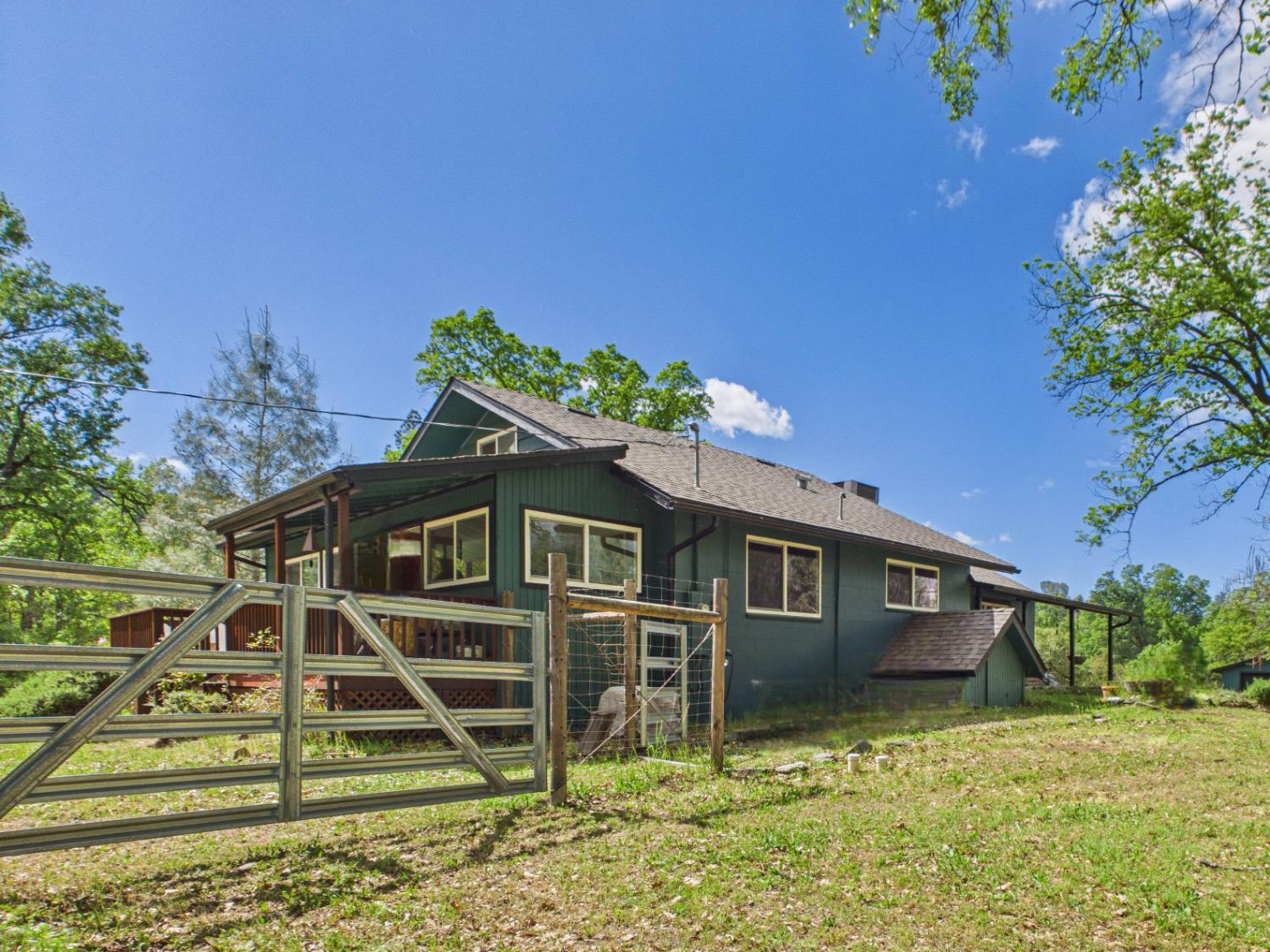 37777 China Creek Road Oakhurst, CA 93644 - Photo 46 of 64 a front view of a house with a yard