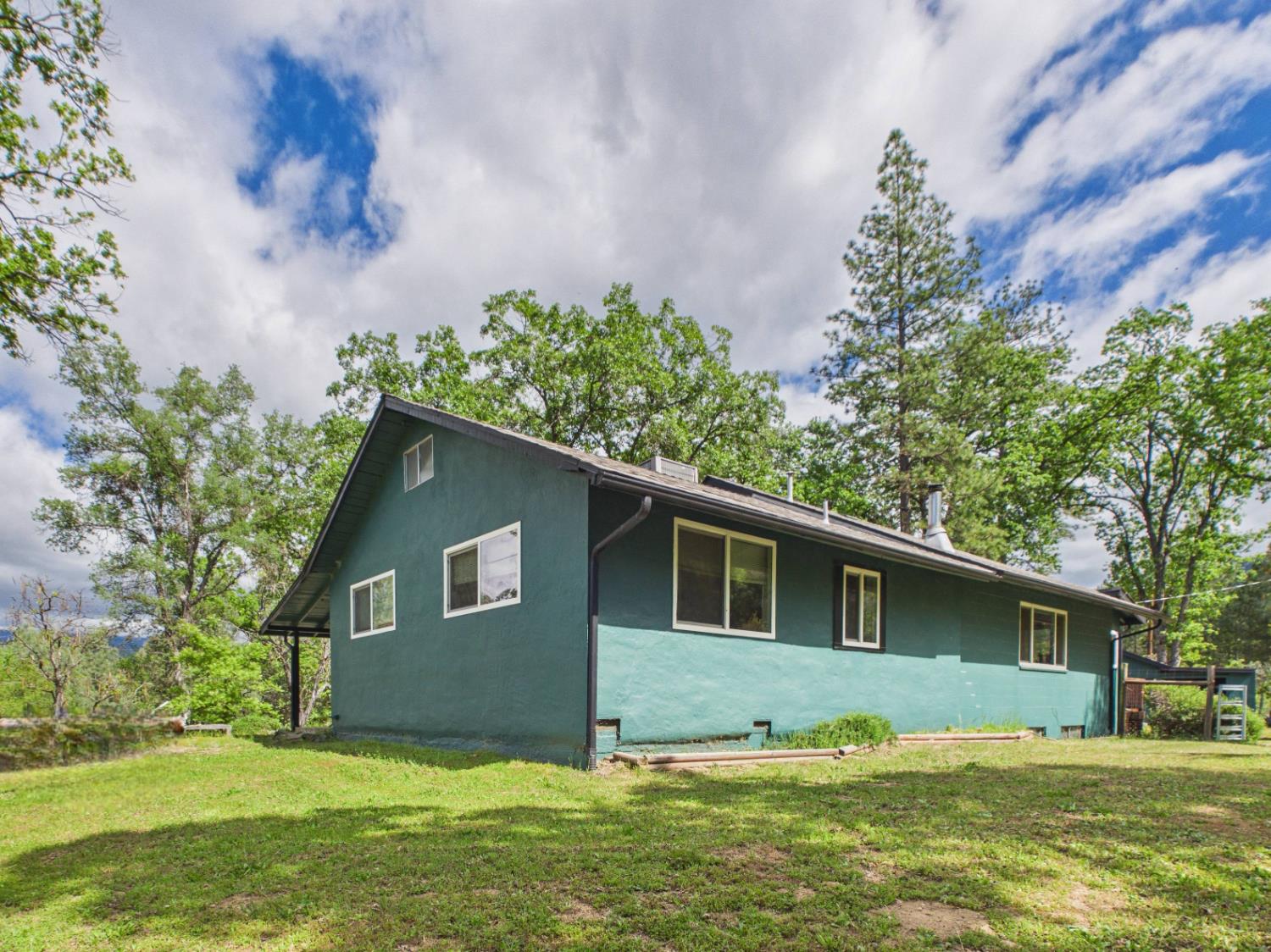 37777 China Creek Road Oakhurst, CA 93644 - Photo 52 of 64 a view of a house with a yard
