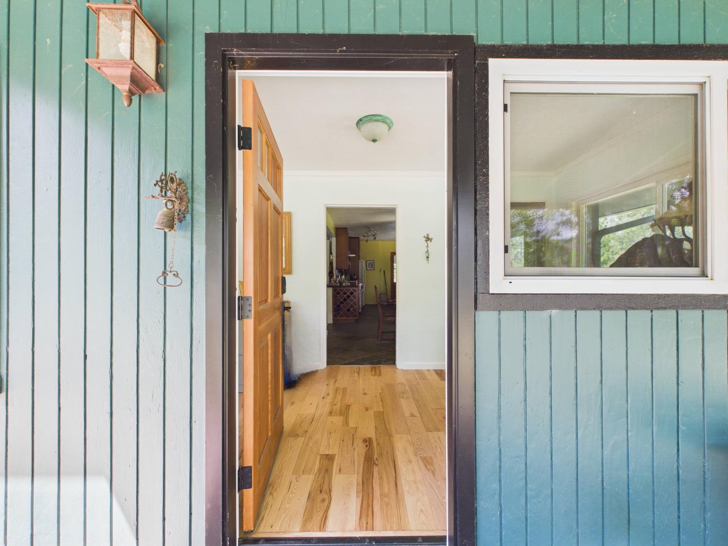 37777 China Creek Road Oakhurst, CA 93644 - Photo 6 of 64 a view of a door front of a house