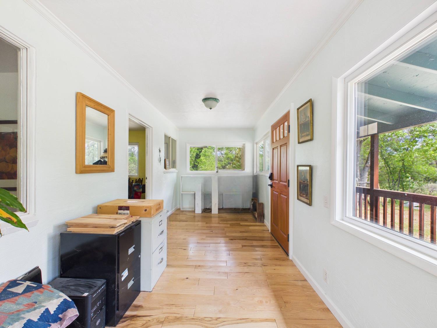 37777 China Creek Road Oakhurst, CA 93644 - Photo 9 of 64 a view of a bedroom with a window and storage