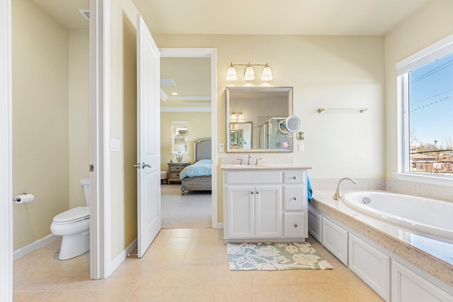1875 Worthington Circle Santa Clara, CA 95050 - Photo 21 of 39 a bathroom with a tub sink toilet and mirror