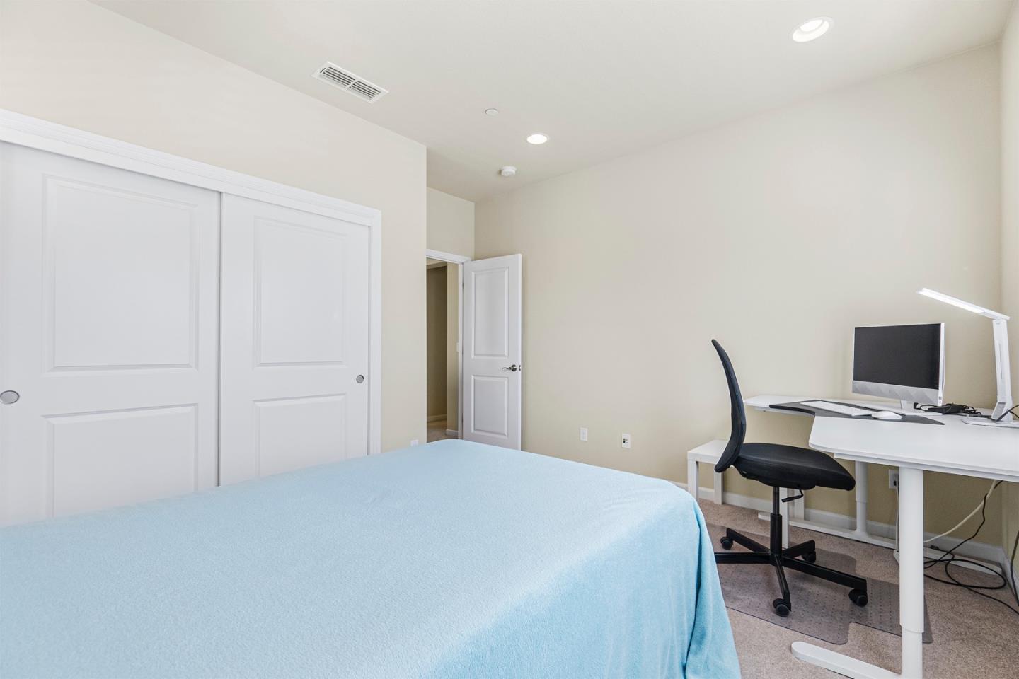 1875 Worthington Circle Santa Clara, CA 95050 - Photo 25 of 39 a bedroom with a bed and a desk