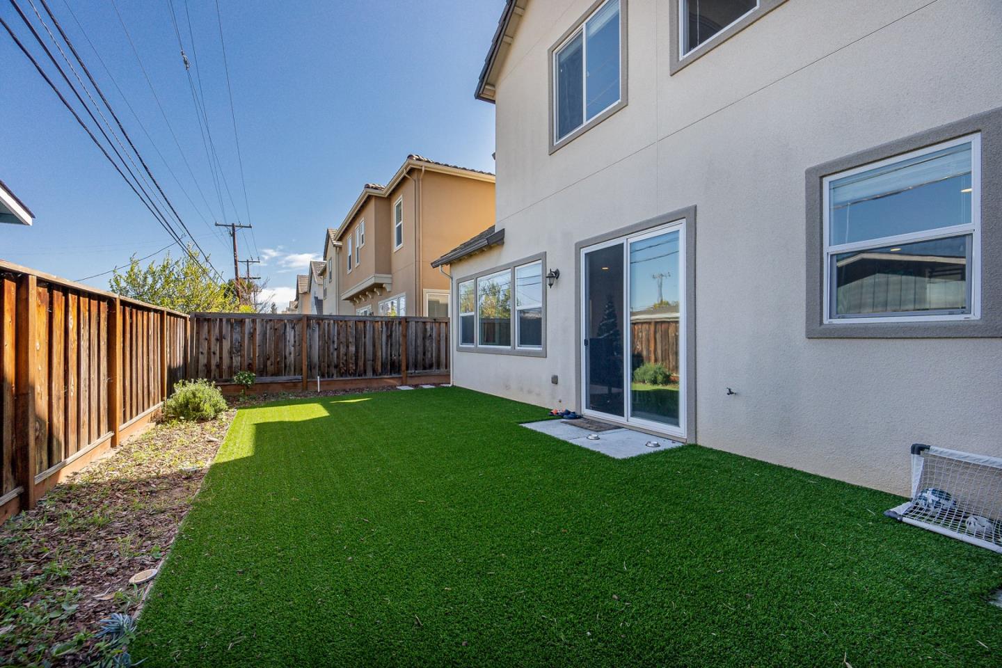 1875 Worthington Circle Santa Clara, CA 95050 - Photo 34 of 39 a view of a backyard with table and chairs and wooden fence