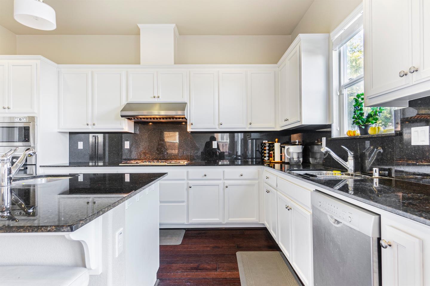 1875 Worthington Circle Santa Clara, CA 95050 - Photo 9 of 39 a kitchen with granite countertop a sink stainless steel appliances and cabinets