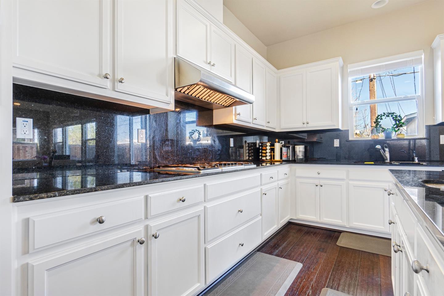 1875 Worthington Circle Santa Clara, CA 95050 - Photo 10 of 39 a kitchen with granite countertop white cabinets and white appliances