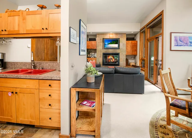 a view of a patio with a table chairs and a backyard