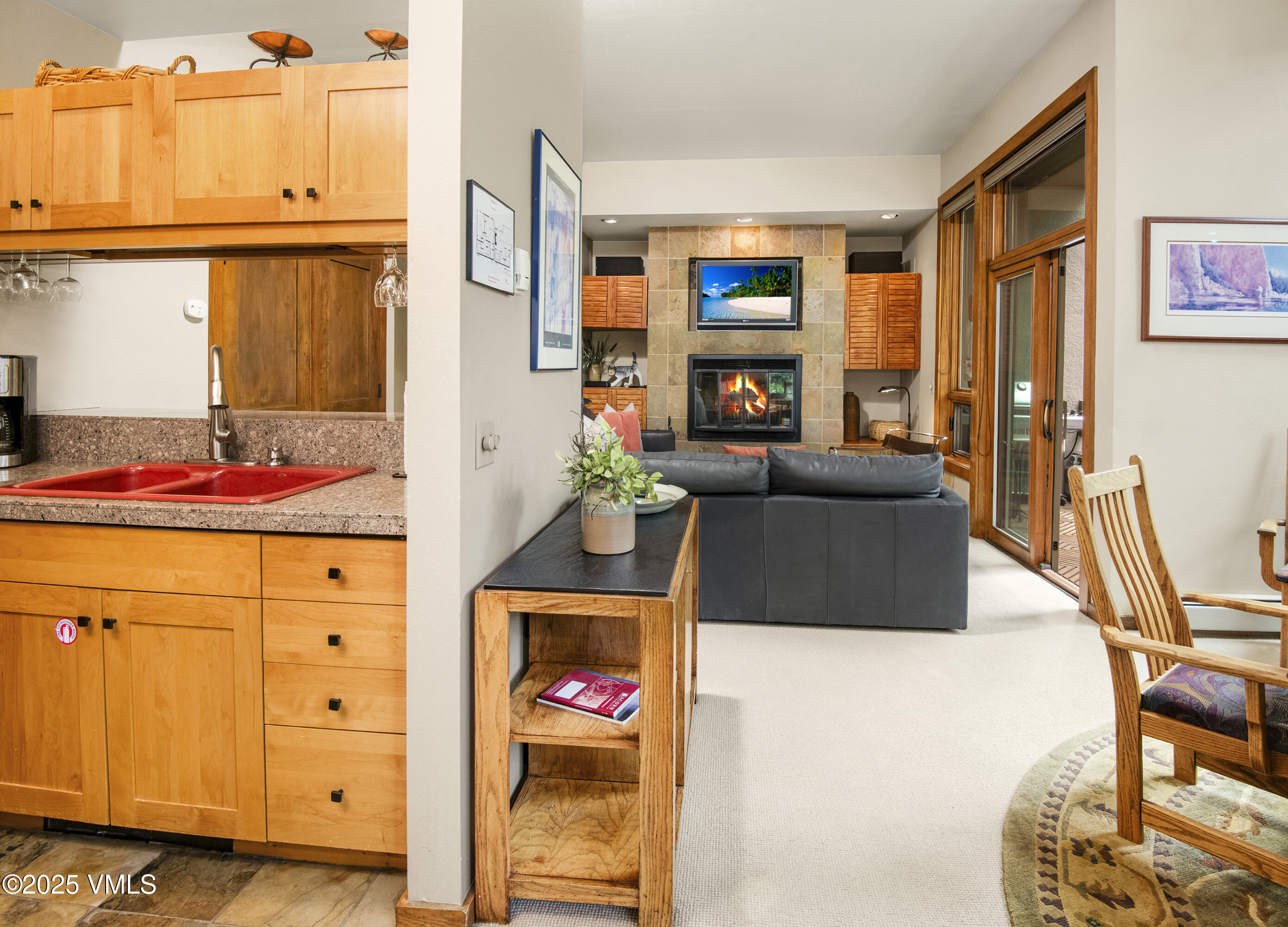 1360 Westhaven Drive, Unit 5A Vail, CO 81657 - Photo 12 of 60 a living room with furniture a flat screen tv and a window