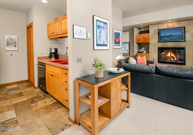 a view of a kitchen with a sink and cabinets
