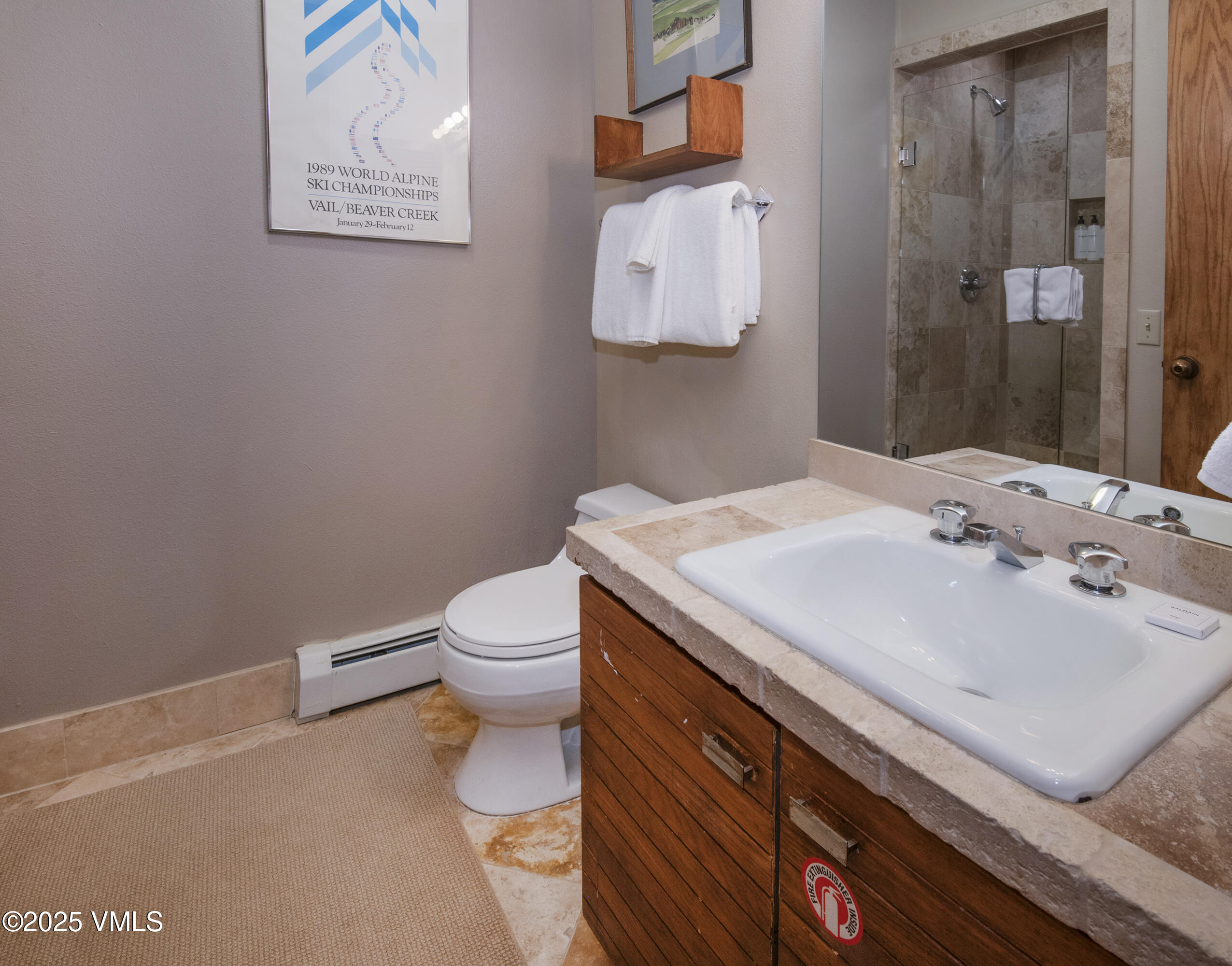 1360 Westhaven Drive, Unit 5A Vail, CO 81657 - Photo 26 of 60 a bathroom with a sink toilet and shower