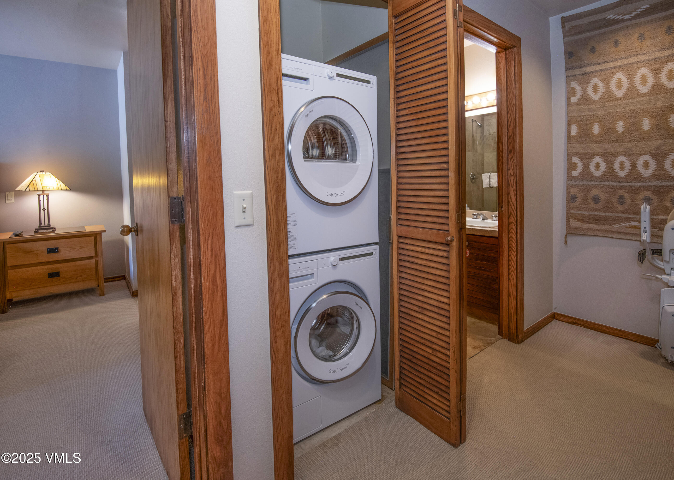 1360 Westhaven Drive, Unit 5A Vail, CO 81657 - Photo 31 of 60 a view of a bedroom with washer and dryer