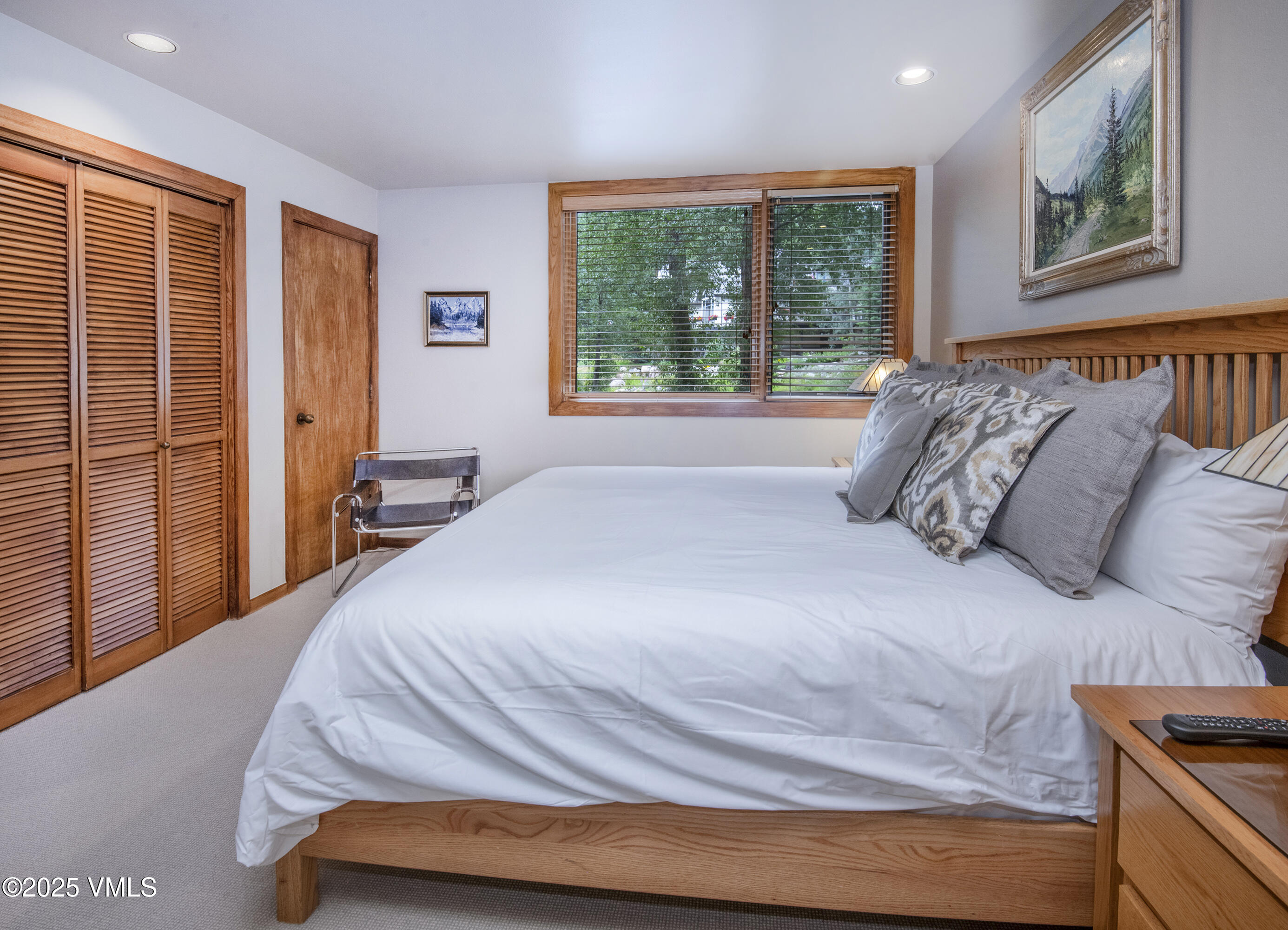 1360 Westhaven Drive, Unit 5A Vail, CO 81657 - Photo 33 of 60 a bedroom with a bed and a large window