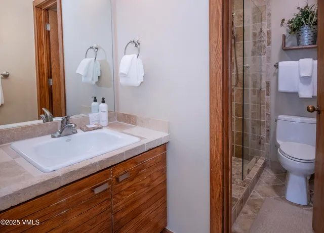 a front view of a house with garden and porch