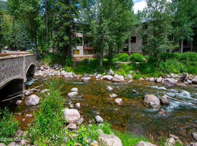a view of a lake with a building in the background