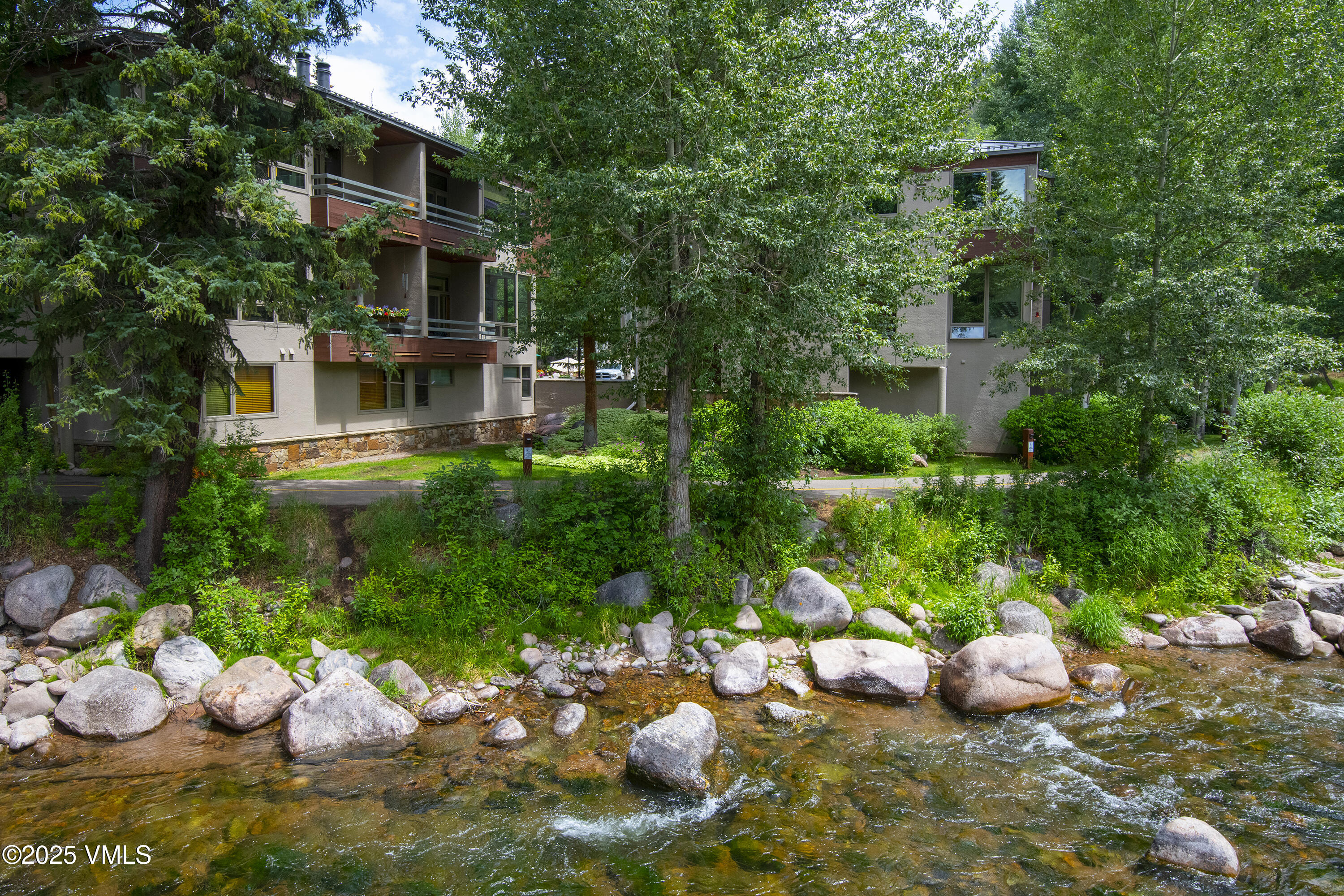 1360 Westhaven Drive, Unit 5A Vail, CO 81657 - Photo 46 of 60 a front view of a house with a yard and sitting area