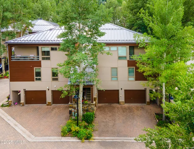 a front view of house with outdoor space and swimming pool
