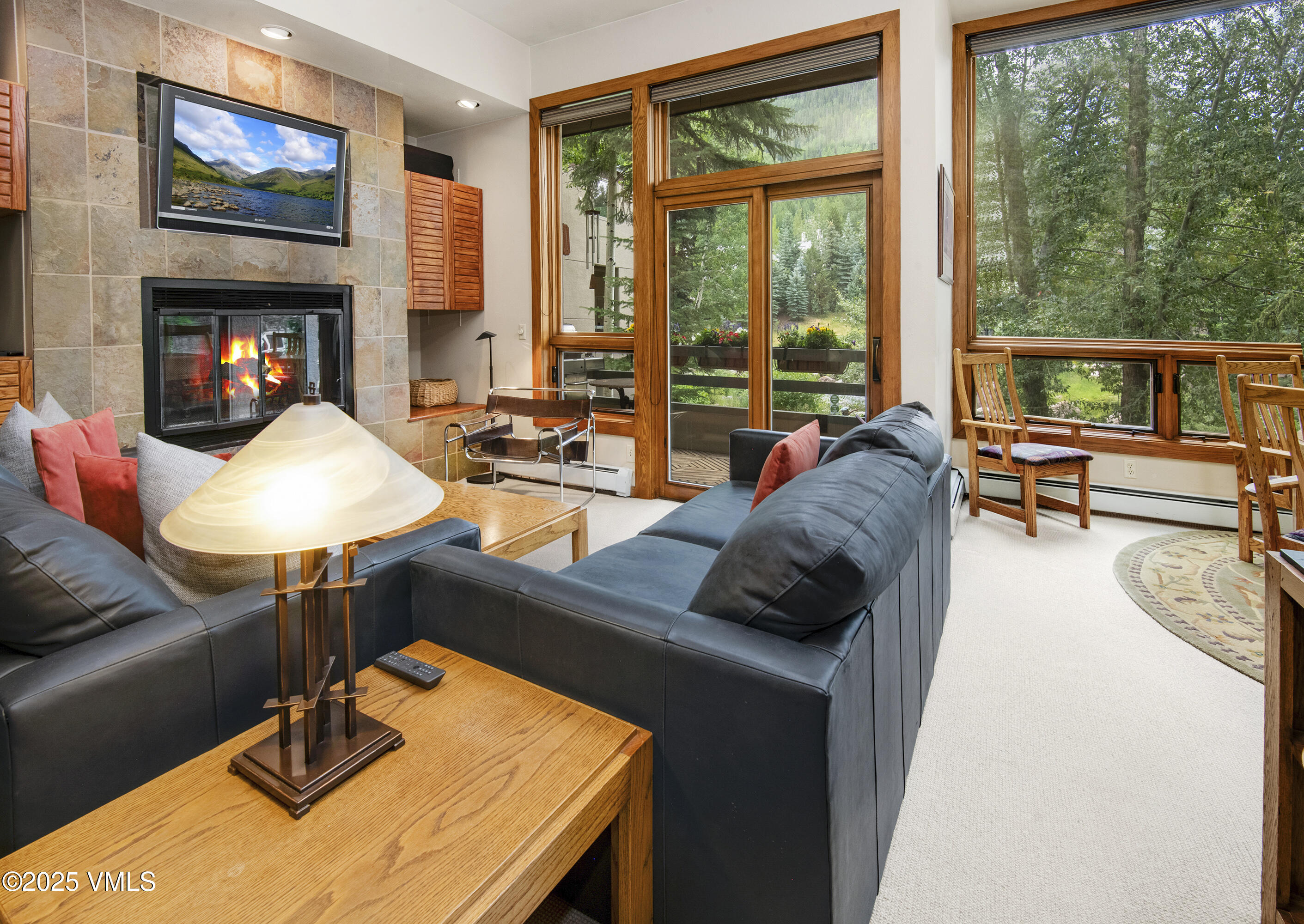1360 Westhaven Drive, Unit 5A Vail, CO 81657 - Photo 5 of 60 a living room with furniture and a fireplace