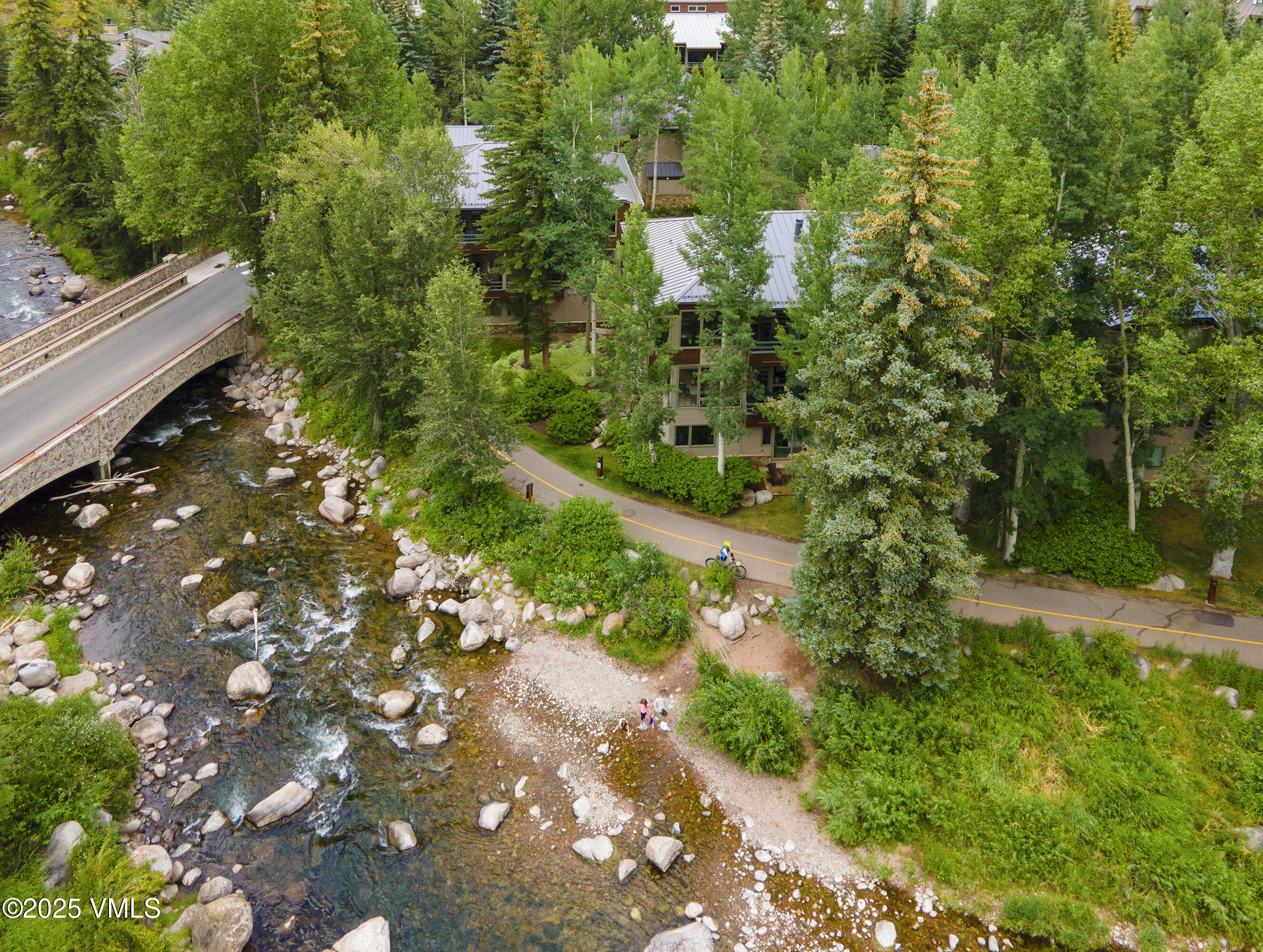 1360 Westhaven Drive, Unit 5A Vail, CO 81657 - Photo 51 of 60 a backyard of a house with a yard and outdoor seating