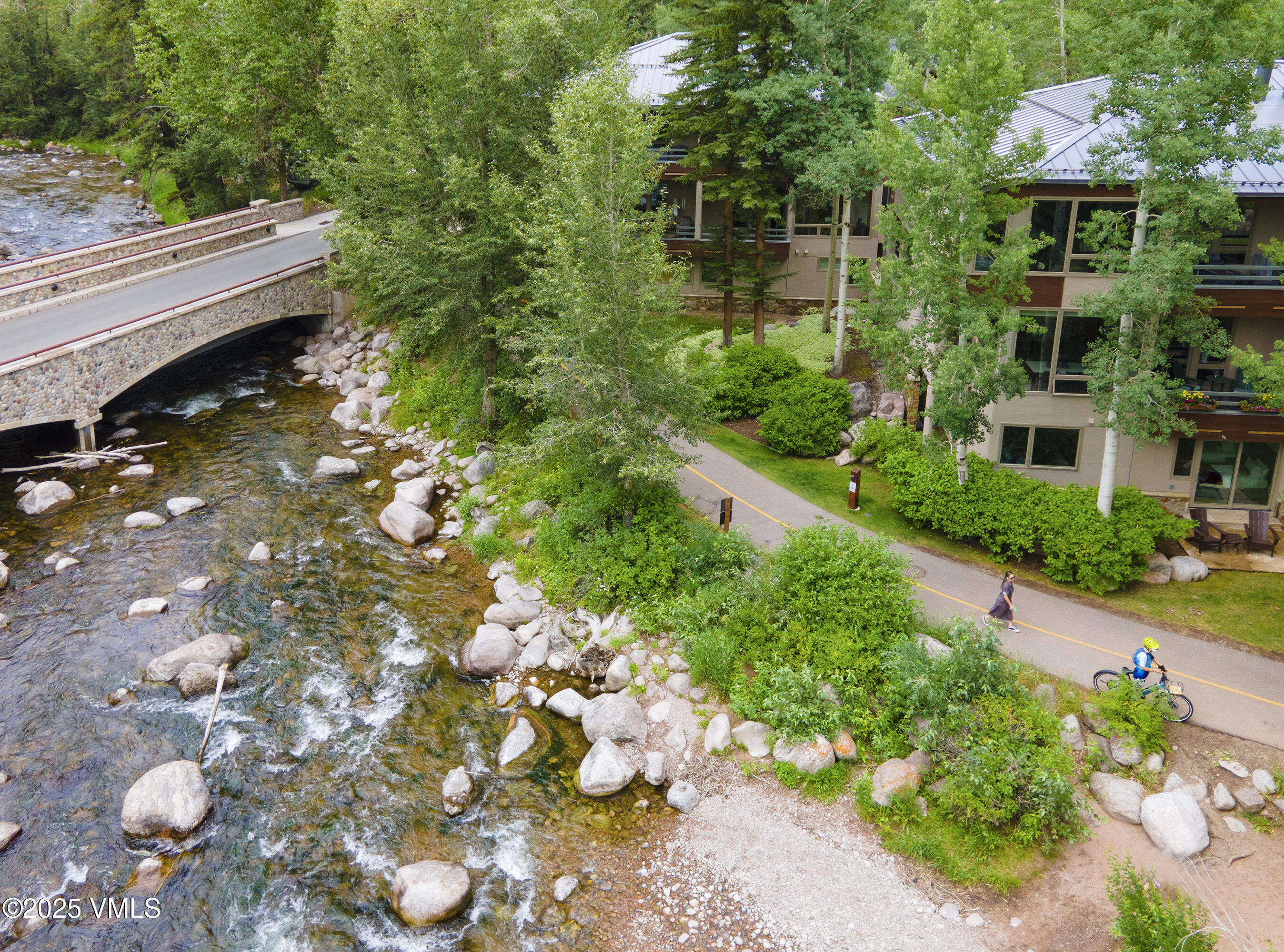 1360 Westhaven Drive, Unit 5A Vail, CO 81657 - Photo 52 of 60 a backyard of a house with yard and outdoor seating