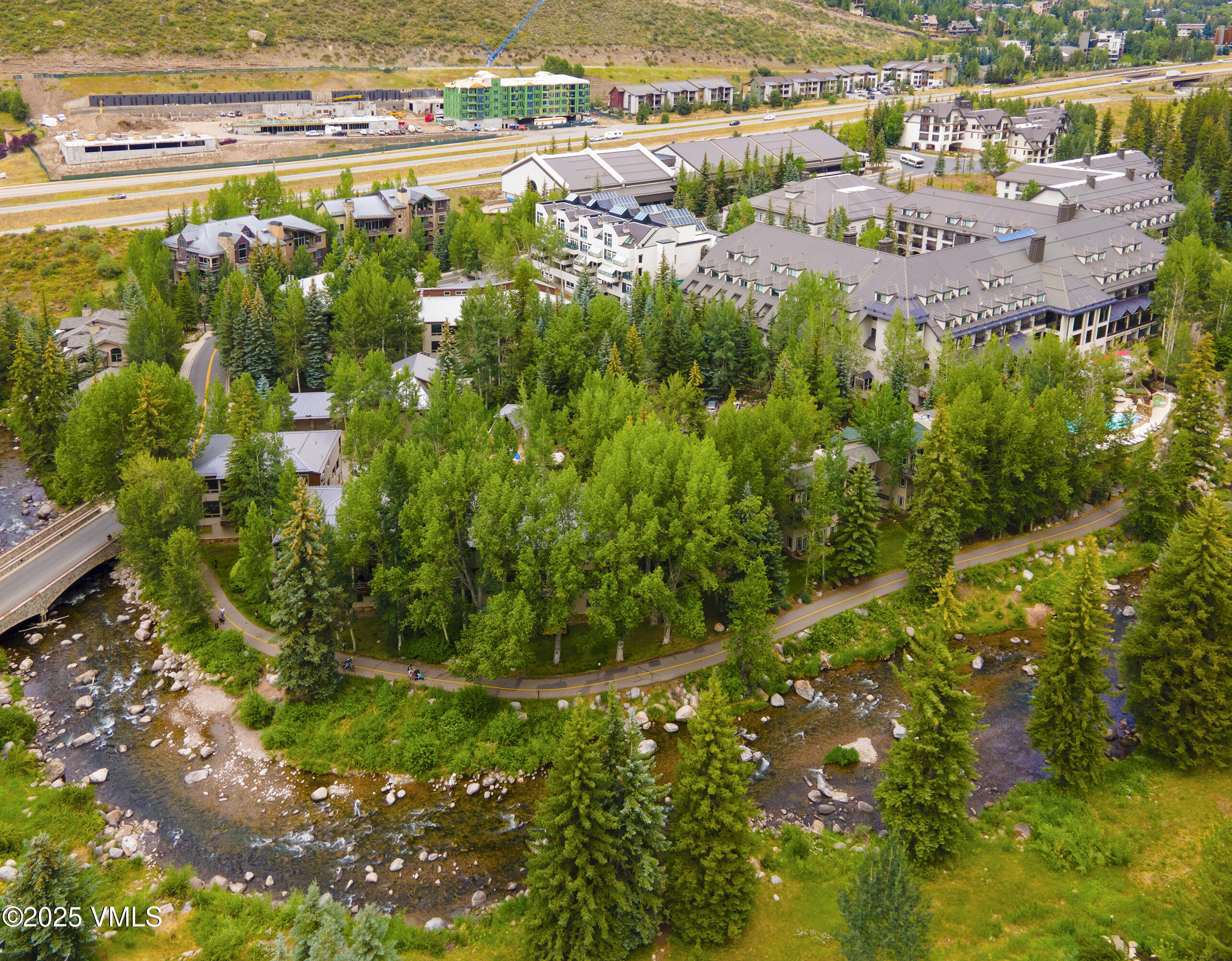 1360 Westhaven Drive, Unit 5A Vail, CO 81657 - Photo 55 of 60 a view of a lake with a building in the background