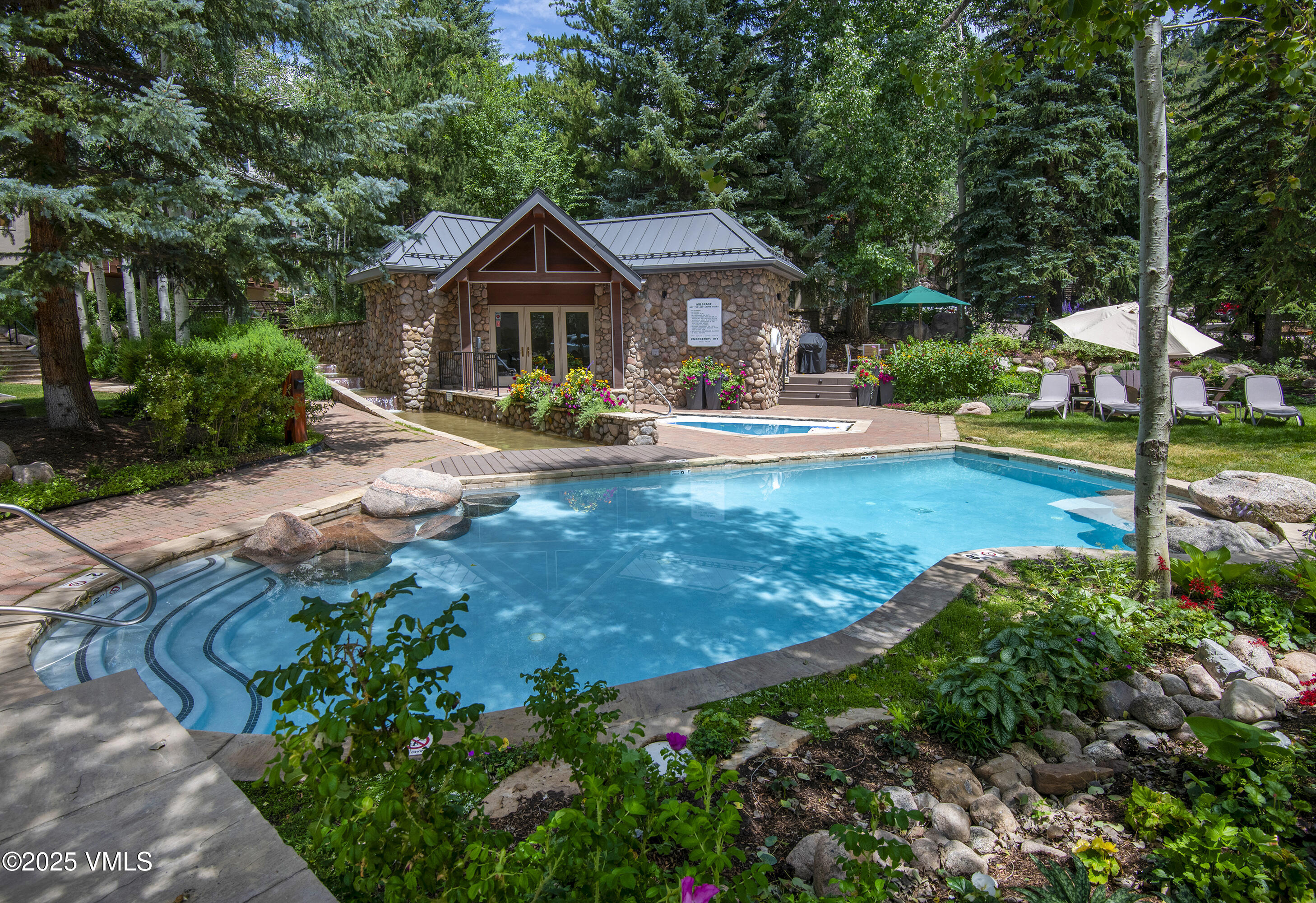 1360 Westhaven Drive, Unit 5A Vail, CO 81657 - Photo 56 of 60 a front view of a house with yard and green space