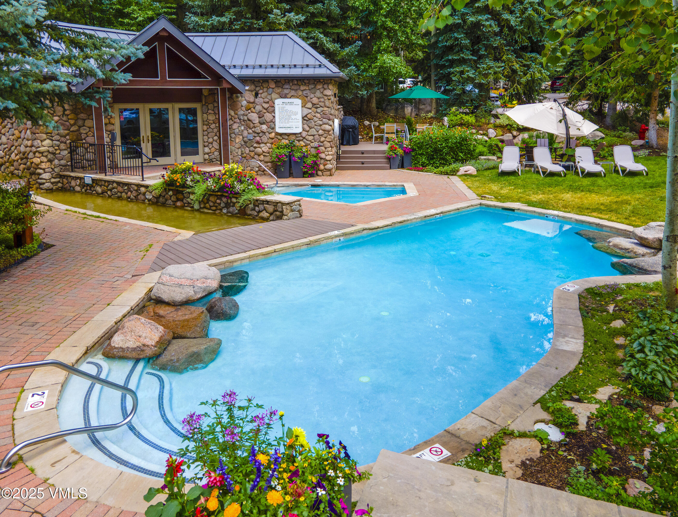 1360 Westhaven Drive, Unit 5A Vail, CO 81657 - Photo 58 of 60 a front view of house with outdoor space and swimming pool
