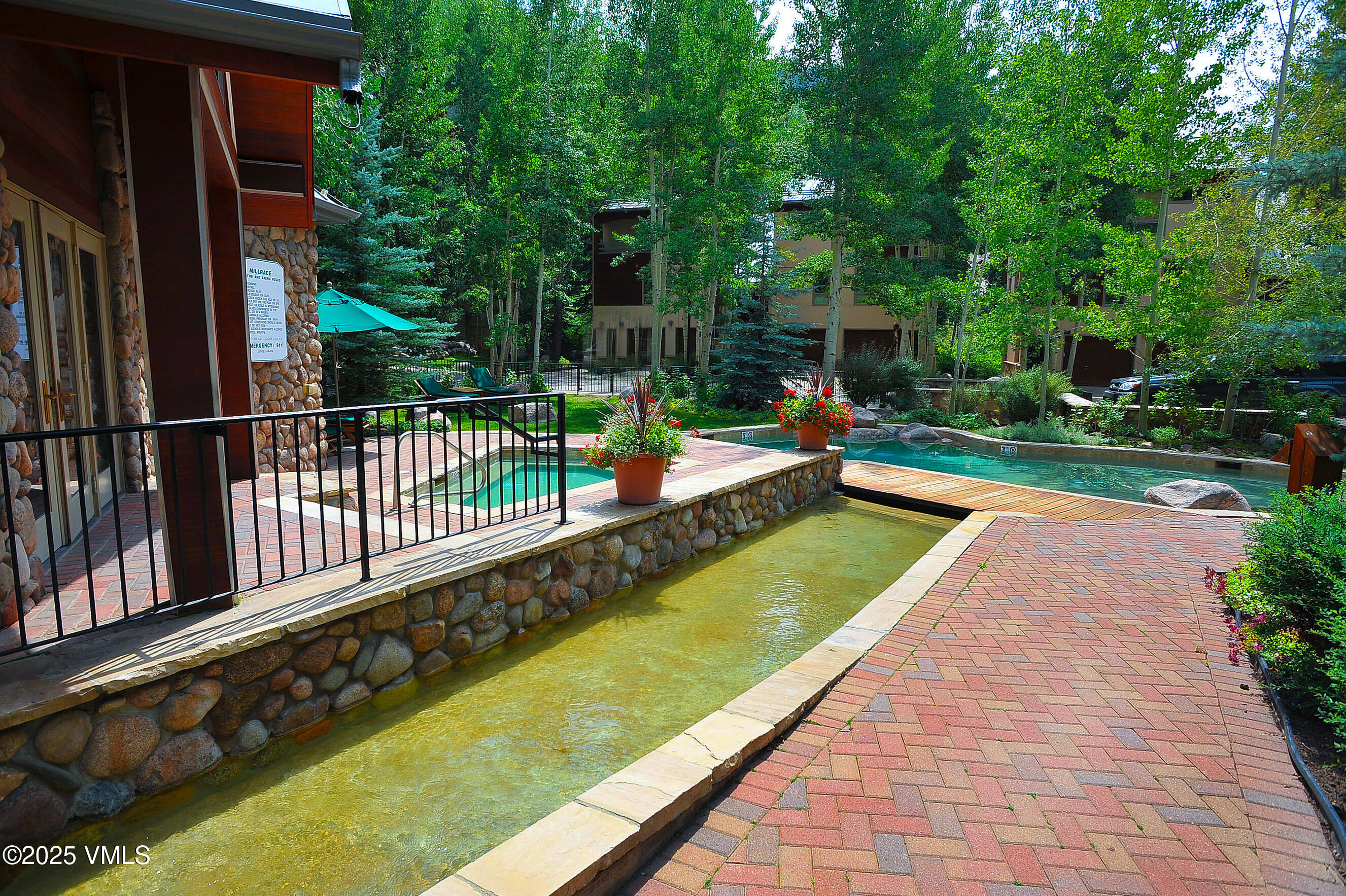 1360 Westhaven Drive, Unit 5A Vail, CO 81657 - Photo 59 of 60 a view of swimming pool with a patio