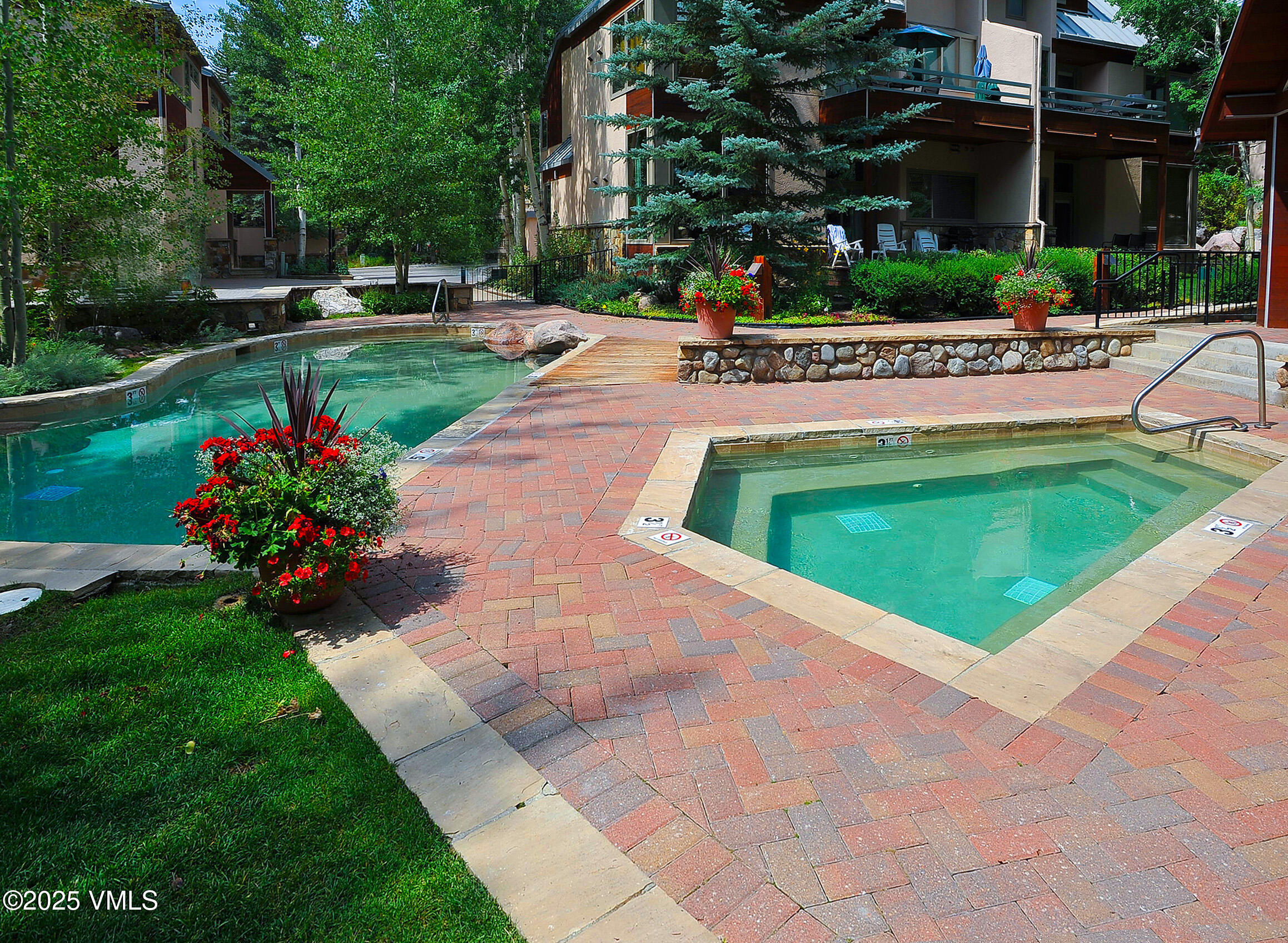 1360 Westhaven Drive, Unit 5A Vail, CO 81657 - Photo 60 of 60 a view of a garden with a bench