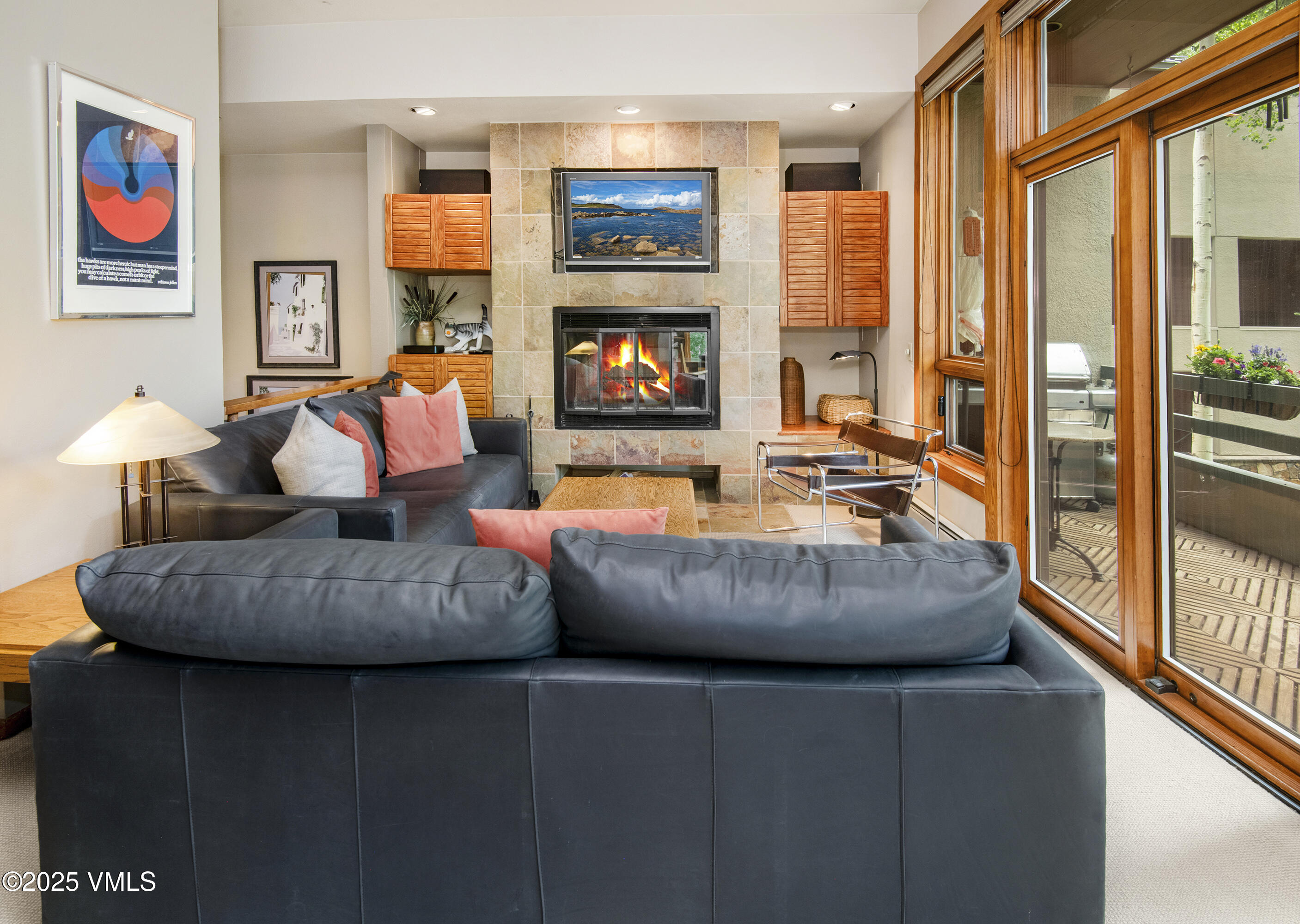 1360 Westhaven Drive, Unit 5A Vail, CO 81657 - Photo 8 of 60 a living room with furniture and a flat screen tv