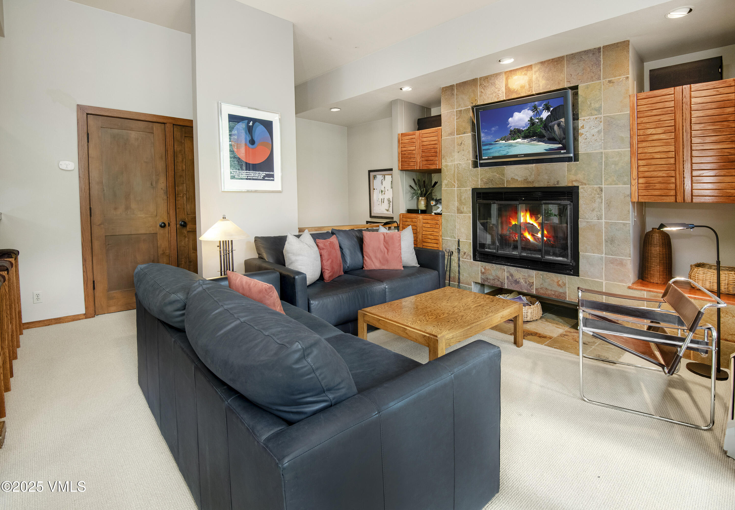1360 Westhaven Drive, Unit 5A Vail, CO 81657 - Photo 9 of 60 a living room with furniture and a fireplace