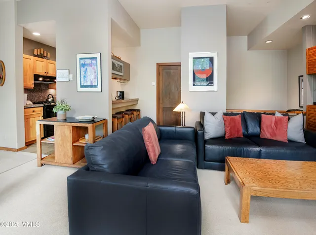 a kitchen with stainless steel appliances granite countertop a stove and a refrigerator