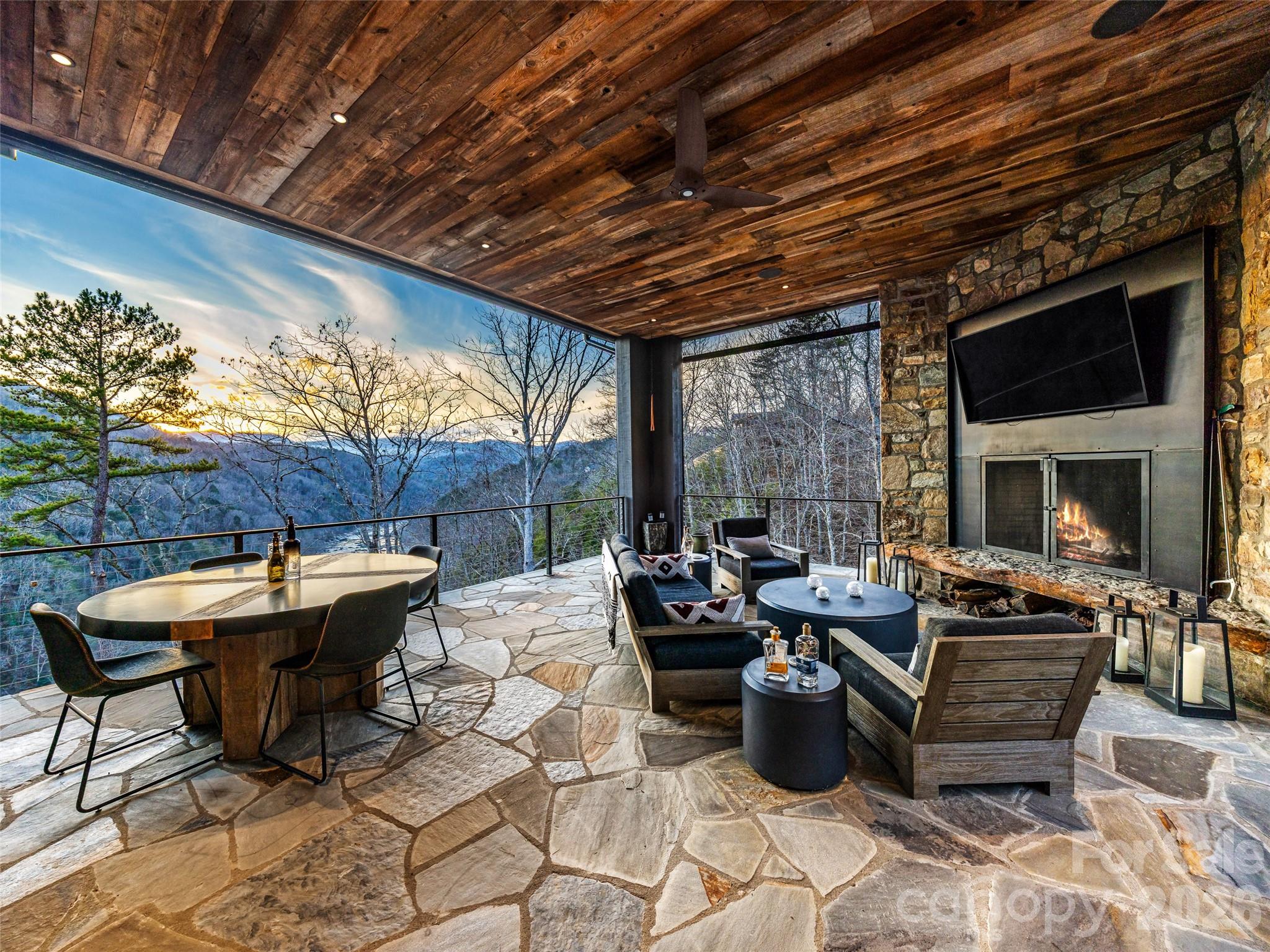 112 Moon Shadow Lane Marshall, NC 28753 - Photo 11 of 48 a outdoor space with patio furniture and a fireplace