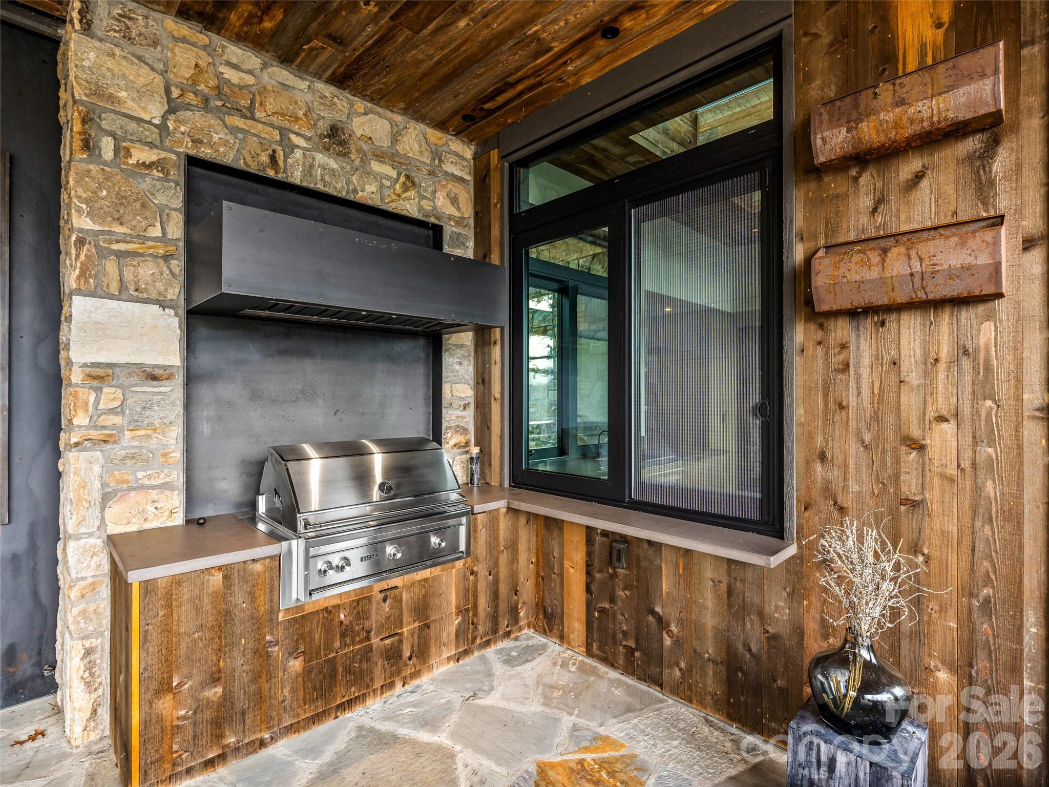 112 Moon Shadow Lane Marshall, NC 28753 - Photo 12 of 48 a kitchen with stainless steel appliances wooden cabinets and a stove top oven