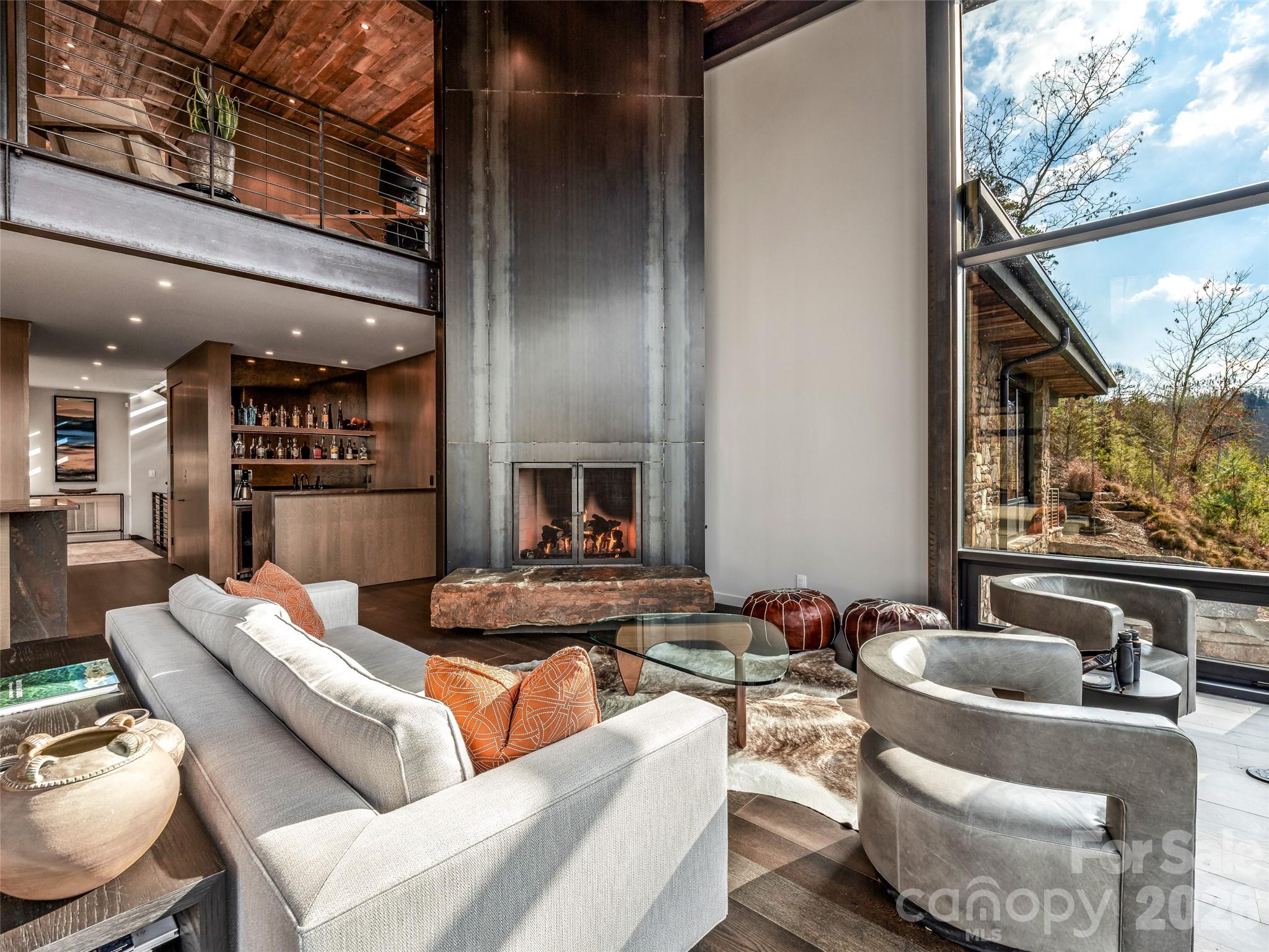 112 Moon Shadow Lane Marshall, NC 28753 - Photo 16 of 48 a living room with furniture and a large window