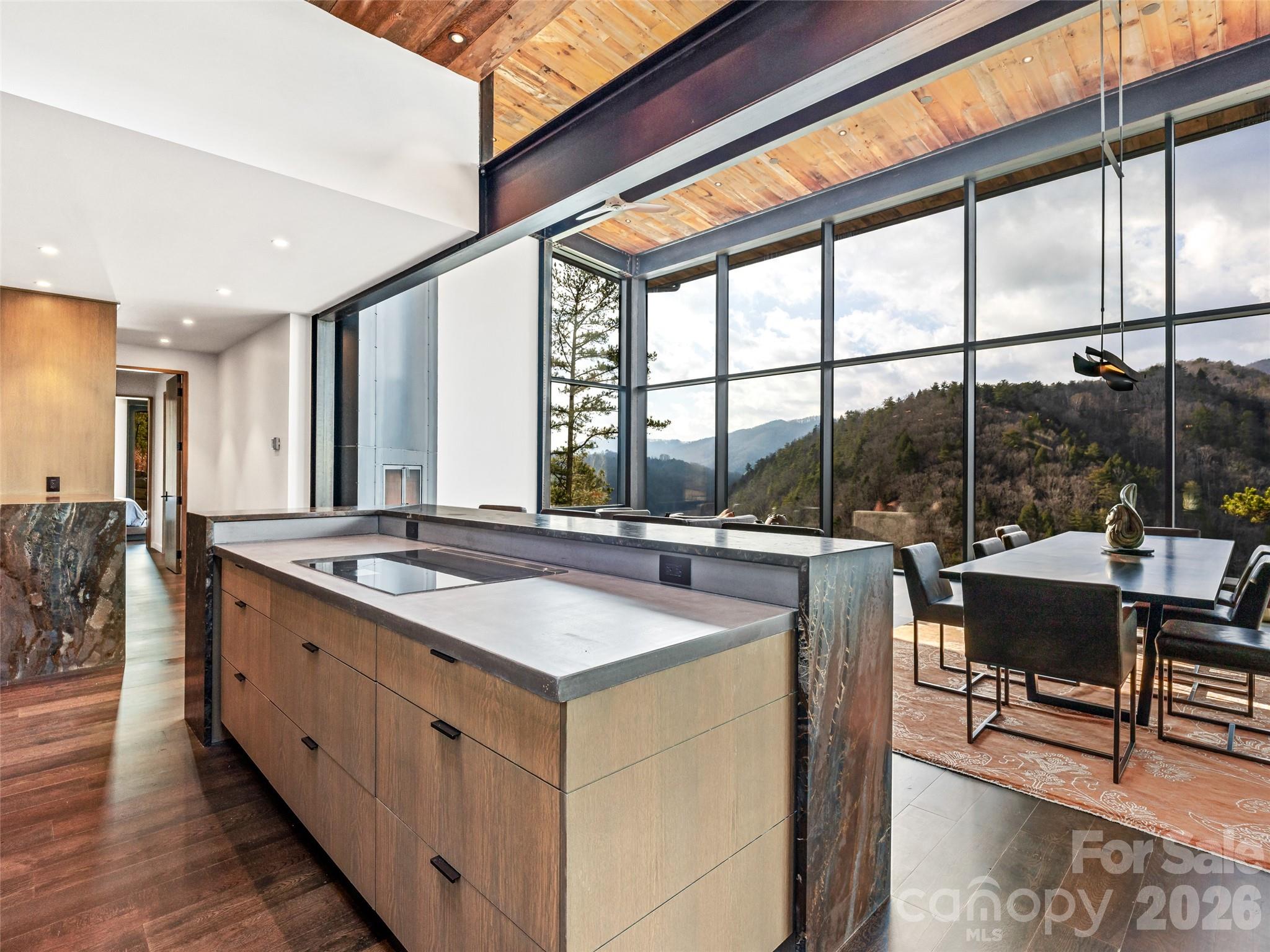 112 Moon Shadow Lane Marshall, NC 28753 - Photo 21 of 48 a large kitchen with kitchen island a sink and a large window