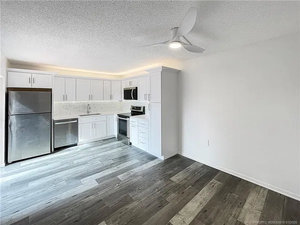a view of kitchen with wooden floor