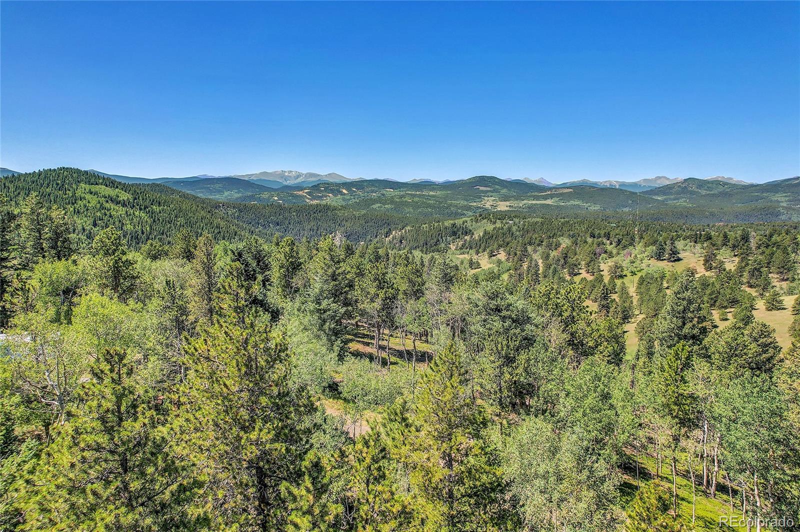 4 Hughesville Road Black Hawk, CO 80422 - Photo 8 of 29 a view of a city with lush green forest
