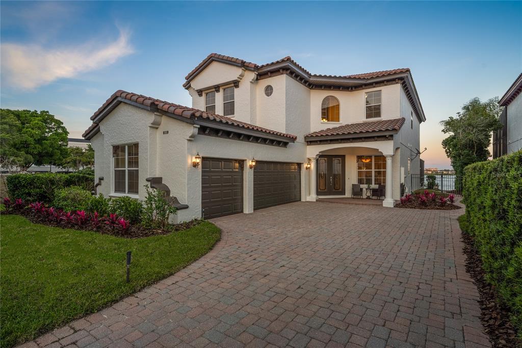 8119 Vía Rosa Orlando, FL 32836 - Photo 1 of 62 a front view of a house with a yard and garage