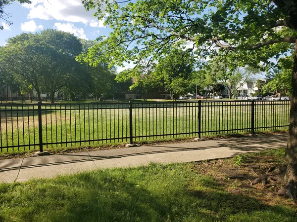 a view of a green field with clear sky