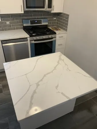 a close view of kitchen sink and stove