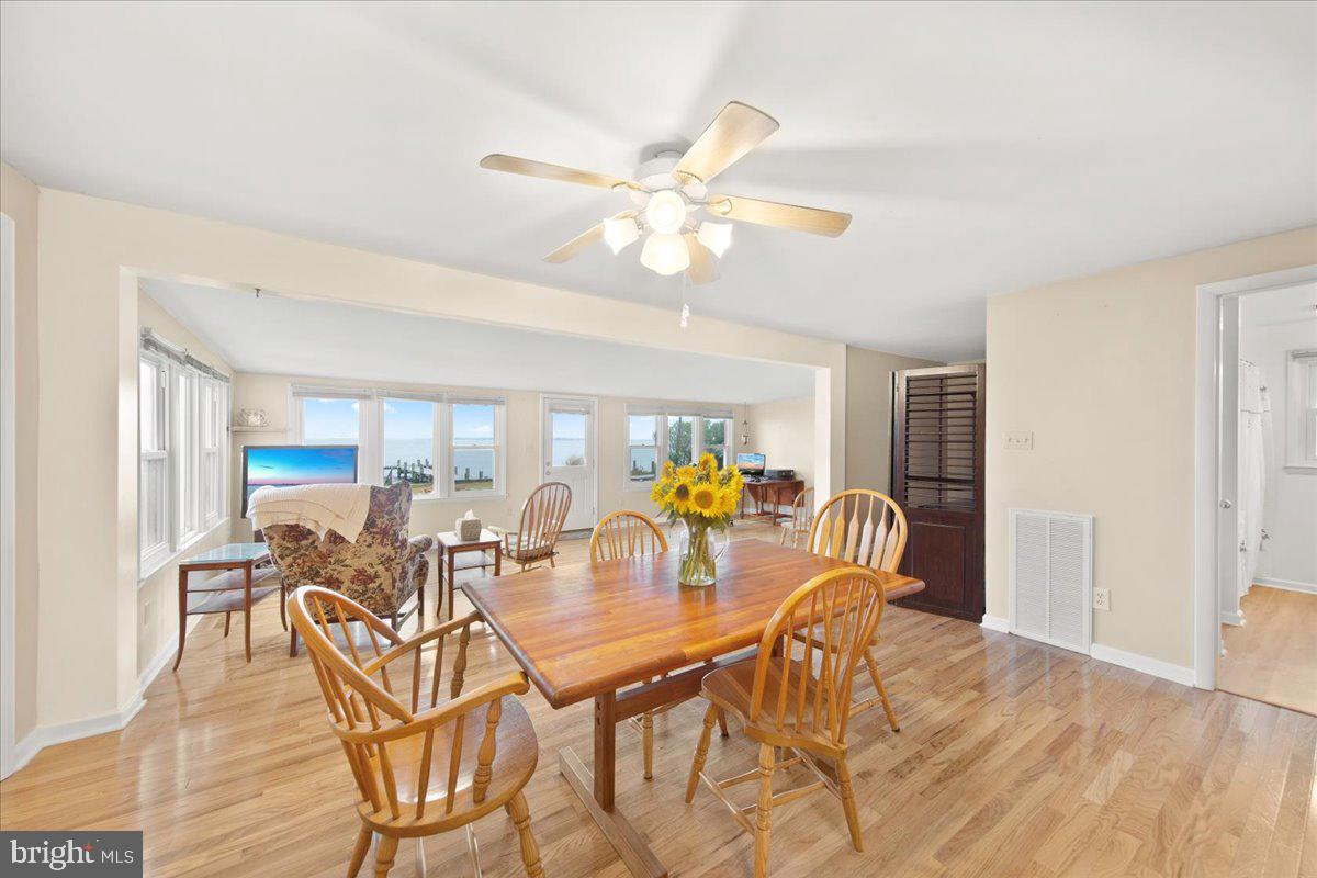 24524 Fullbrook Lane Dames Quarter, MD 21821 - Photo 11 of 45 a view of a dining room with furniture window and wooden floor