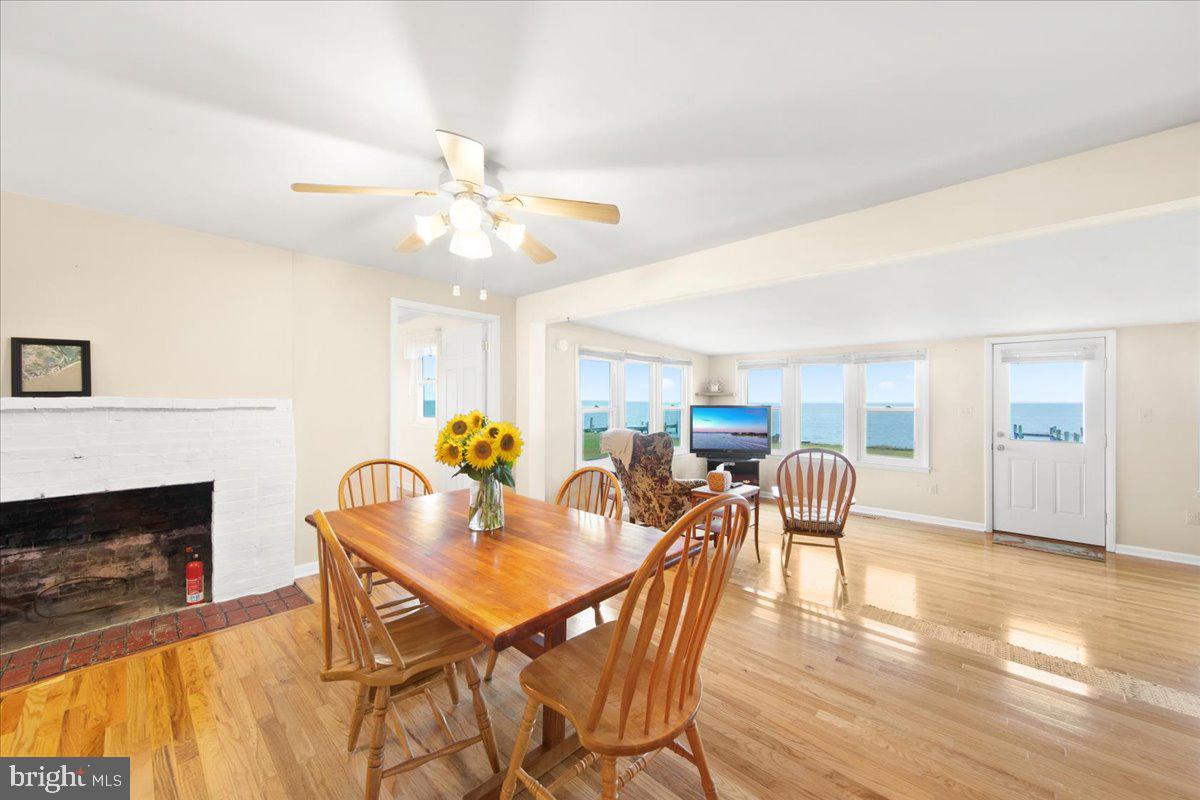 24524 Fullbrook Lane Dames Quarter, MD 21821 - Photo 13 of 45 a view of a dining room with furniture a chandelier and wooden floor