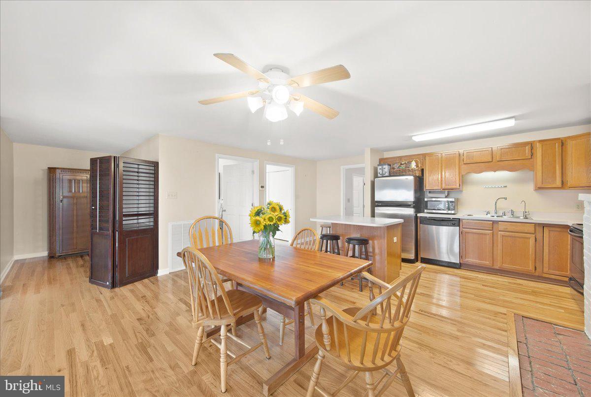 24524 Fullbrook Lane Dames Quarter, MD 21821 - Photo 14 of 45 a view of a dining room with furniture and a kitchen